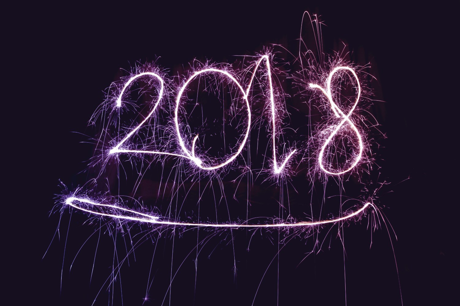 2018 in purple neon fireworks letters