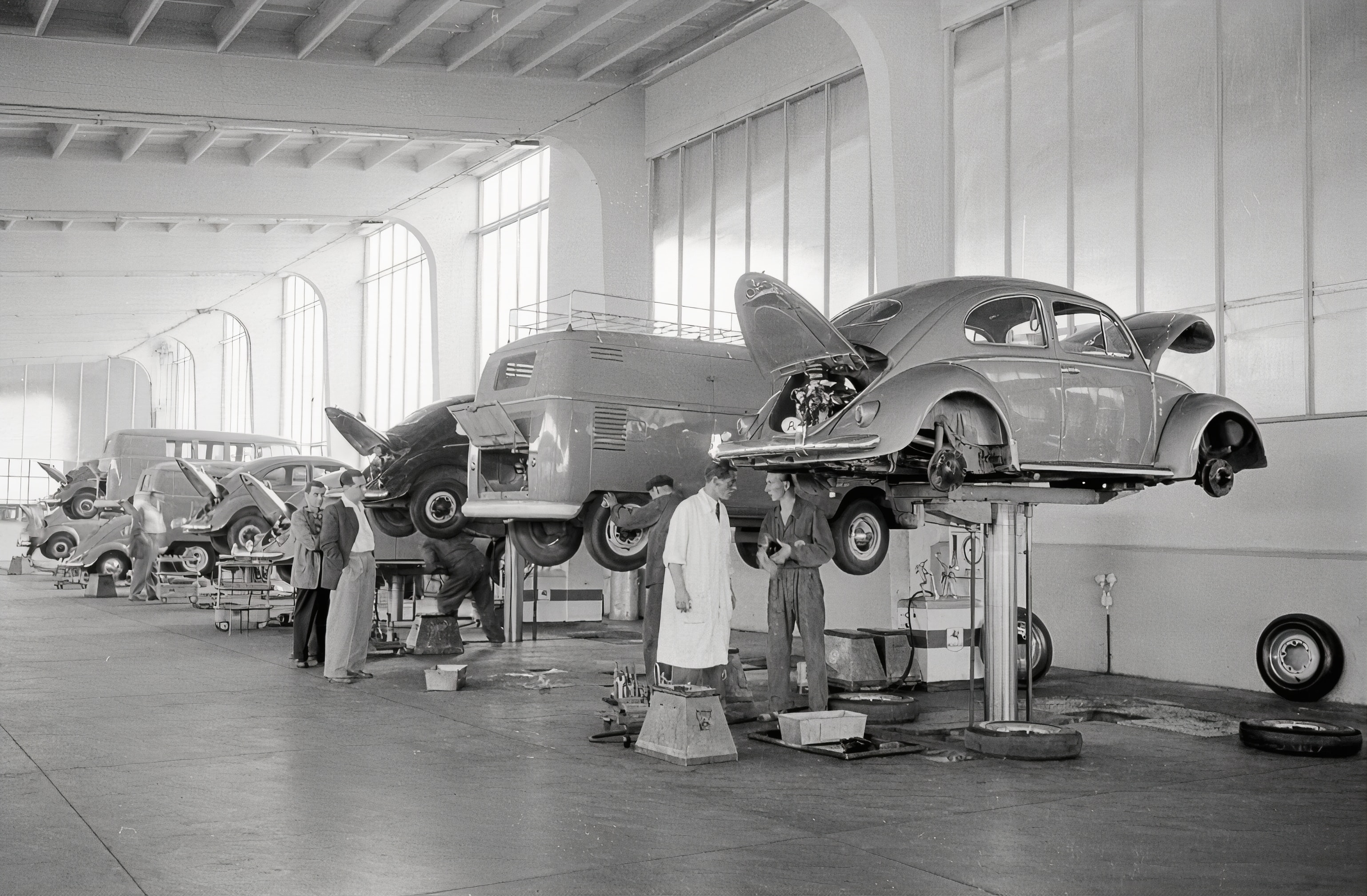 An assembly line of VW bugs