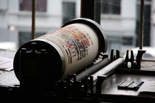 An old color printing machine, transferring a color image to paper.