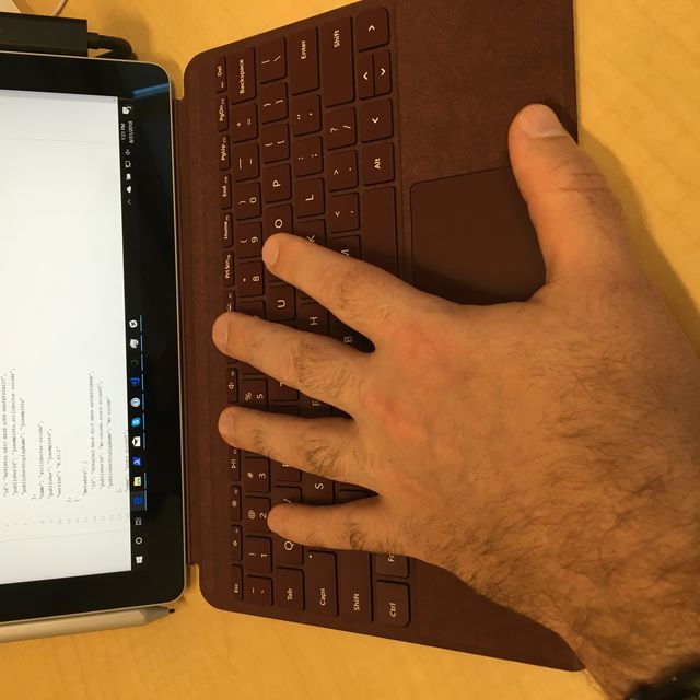 My hand on the Surface Go keyboard